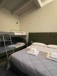 Postel nebo postele na pokoji v ubytování Modus Aquae