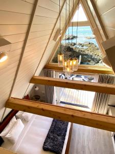 an attic room with a view of the ocean at Duffin Cove Resort in Tofino