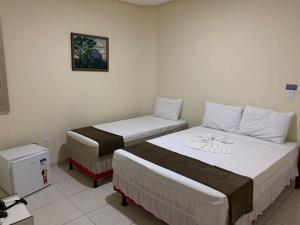 Postel nebo postele na pokoji v ubytování Hotel Alelos - Ituaçu Bahia