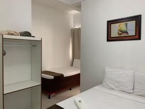 Кровать или кровати в номере Hotel Alelos