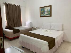 Postel nebo postele na pokoji v ubytování Hotel Alelos - Ituaçu Bahia