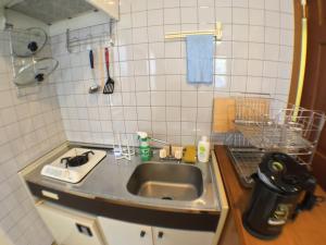 Kuchyň nebo kuchyňský kout v ubytování Oli Oli Guesthouse + 37 fotografií