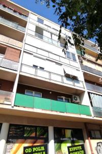 a tall white building with a lot of windows at Apartments with WiFi Sibenik - 20831 in Šibenik