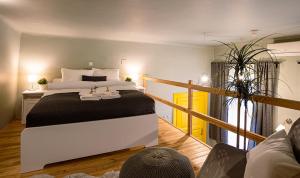 A bed or beds in a room at La Bella - Entire Apartment near Gozsdu udvar
