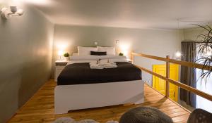 A bed or beds in a room at La Bella - Entire Apartment near Gozsdu udvar