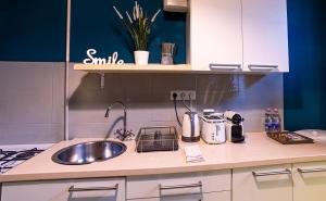 A kitchen or kitchenette at La Bella - Entire Apartment near Gozsdu udvar