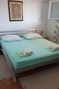 Ліжко або ліжка в номері Seaside holiday house Mali Iz (Iz) - 17536