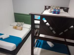 Postel nebo postele na pokoji v ubytování Hotel El Deportista