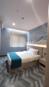 Postel nebo postele na pokoji v ubytování Fan's Hotel- Ormoc