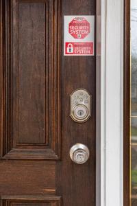 a wooden door with a sign on it at City Chic Private Room & Bath in Atlanta