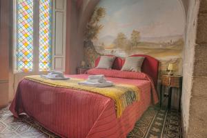 A bed or beds in a room at L'antica Bifore