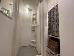 a bathroom with a shower and a walk in closet at Hotel Ougien in Tokyo +170 photos