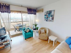a living room with a couch and chairs and a table at Bel appartement avec terrasse, piscine, parking et WiFi - FR-1-196-321 in Menton