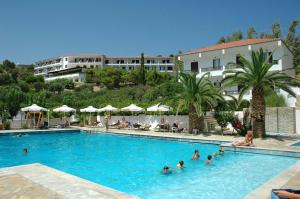 a group of people in a swimming pool at a hotel at Hotel Glicorisa Beach in Pythagoreio