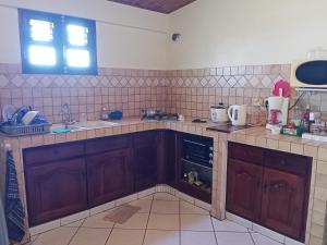 Köök või kööginurk majutusasutuses T3 Bel Enclos SCHOELCHER Kybo Karaib Location Vue mer Calme