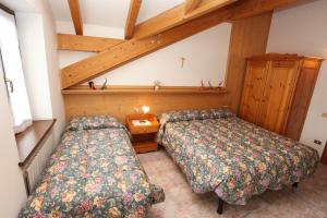 Ένα ή περισσότερα κρεβάτια σε δωμάτιο στο GH Hotel Fratazza