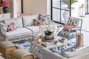 a living room with a couch and chairs at Umbala the house in Canggu +35 photos