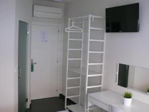 TV a/nebo společenská místnost v ubytování HOSTAL LETTO DAL MARE