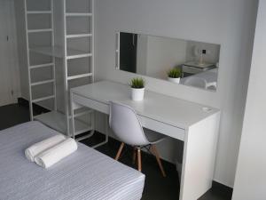 Postel nebo postele na pokoji v ubytování HOSTAL LETTO DAL MARE