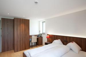 Letto o letti in una camera di Seehotel Delphin