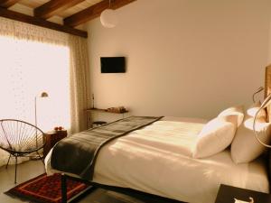 Ένα ή περισσότερα κρεβάτια σε δωμάτιο στο El Hotelito