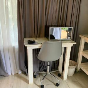 TV a/nebo společenská místnost v ubytování Meraki Upmarket Guesthouse
