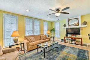 a living room with a couch and a tv at Johnson City Vacation Rental 1 Block to ETSU in Johnson City