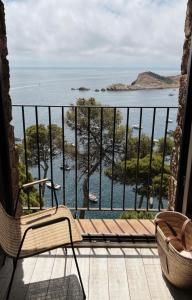 a balcony with a view of the ocean at BYPILLOW Cap Sa Sal in Begur