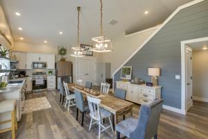 a kitchen with a wooden table and chairs and a dining room at Byrdstown Home Near Dale Hollow Lake! in Byrdstown