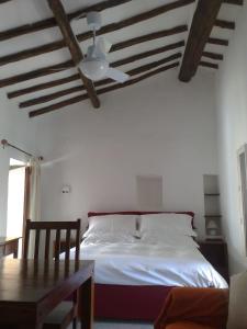 Ένα ή περισσότερα κρεβάτια σε δωμάτιο στο La Locanda Di Cadì