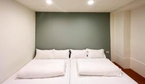 Katil atau katil-katil dalam bilik di Cen Pin B&B