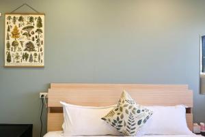 Katil atau katil-katil dalam bilik di Cen Pin B&B