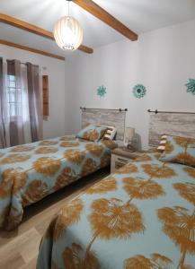 Postel nebo postele na pokoji v ubytování Finca Vistas al Teide con jacuzzi, wifi y TV satélite