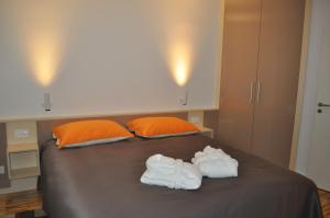 Posteľ alebo postele v izbe v ubytovaní Apartments City&style