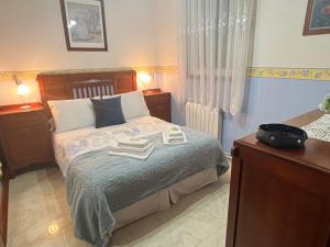 Łóżko lub łóżka w pokoju w obiekcie Villa Playa Portomayor BUEU
