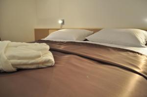 Posteľ alebo postele v izbe v ubytovaní Apartments City&style