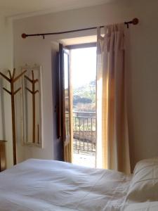 מיטה או מיטות בחדר ב-La Locanda Di Cadì