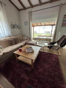 a living room with a couch and a coffee table at 7ο_seahome in Alexandroupoli
