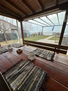 a wooden table with several different types of knitting needles at 7ο_seahome in Alexandroupoli