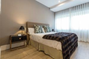Posteľ alebo postele v izbe v ubytovaní Gran vivienda en la Rambla!