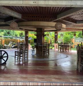 a restaurant with tables and chairs in a courtyard at Greenhut Pension & Bar in Jagna