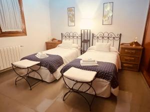 Łóżko lub łóżka w pokoju w obiekcie Villa Playa Portomayor BUEU