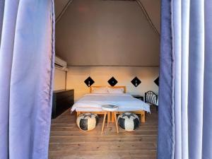 Voodi või voodid majutusasutuse Wadi Rum Camp toas
