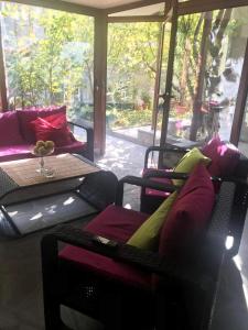 a living room with colorful furniture and a table at Аренда Квартиры в Ереване (Зейтун) - Apartment Rent in Yerevan (Zeytun) in Yerevan