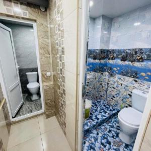 a bathroom with a toilet and a shower at Аренда Квартиры в Ереване (Зейтун) - Apartment Rent in Yerevan (Zeytun) in Yerevan