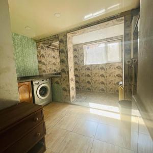 a laundry room with a washing machine and a window at Аренда Квартиры в Ереване (Зейтун) - Apartment Rent in Yerevan (Zeytun) in Yerevan