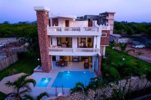 an aerial view of a house with a swimming pool at ZANA DIANI VILLAS in Ukunda