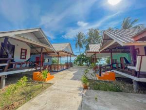 a villa with a view of the ocean at Pyramid Bangalow in Ban Laem Sai