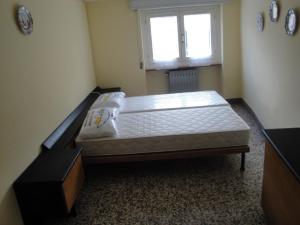 Postel nebo postele na pokoji v ubytování La Piazza B&B