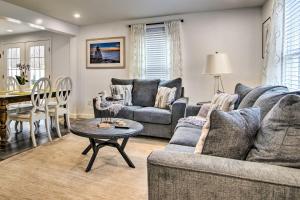 a living room with a couch and a table at Cozy Edgartown Vacation Rental Near Beach! in Edgartown